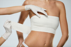 Female Body In White Panties And Breast Bandages