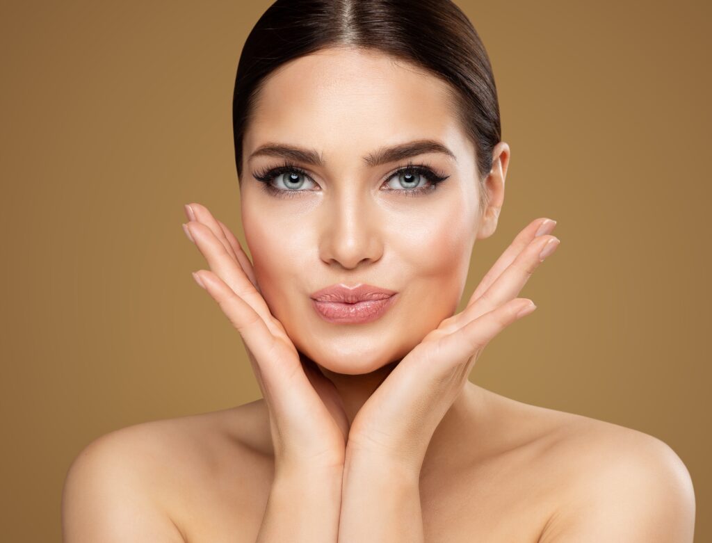 A woman smiling and showing the effects of Volbella® XC lip fillers.