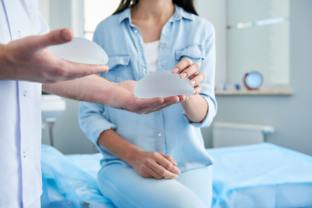 Woman having a breast augmentation consultation with her doctor to choose the best option for her body