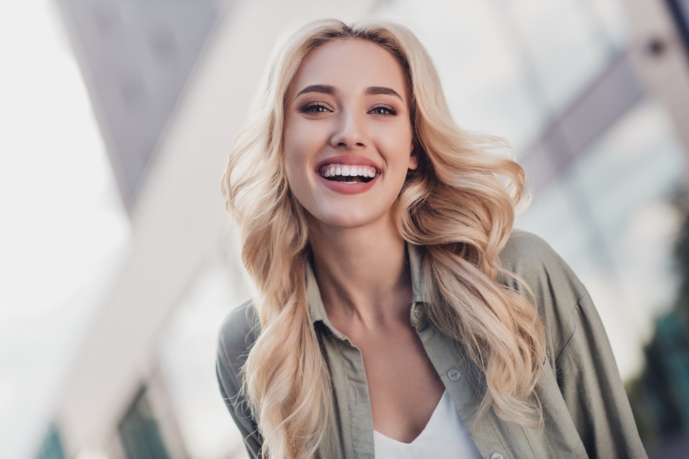 Happy woman with fresh, youthful face from a mid-facelift in Austin, TX