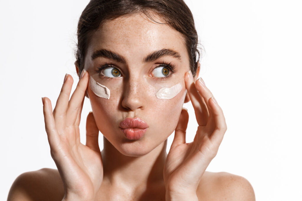 Woman making kissy face with clear skin from laser skin resurfacing in Austin, TX
