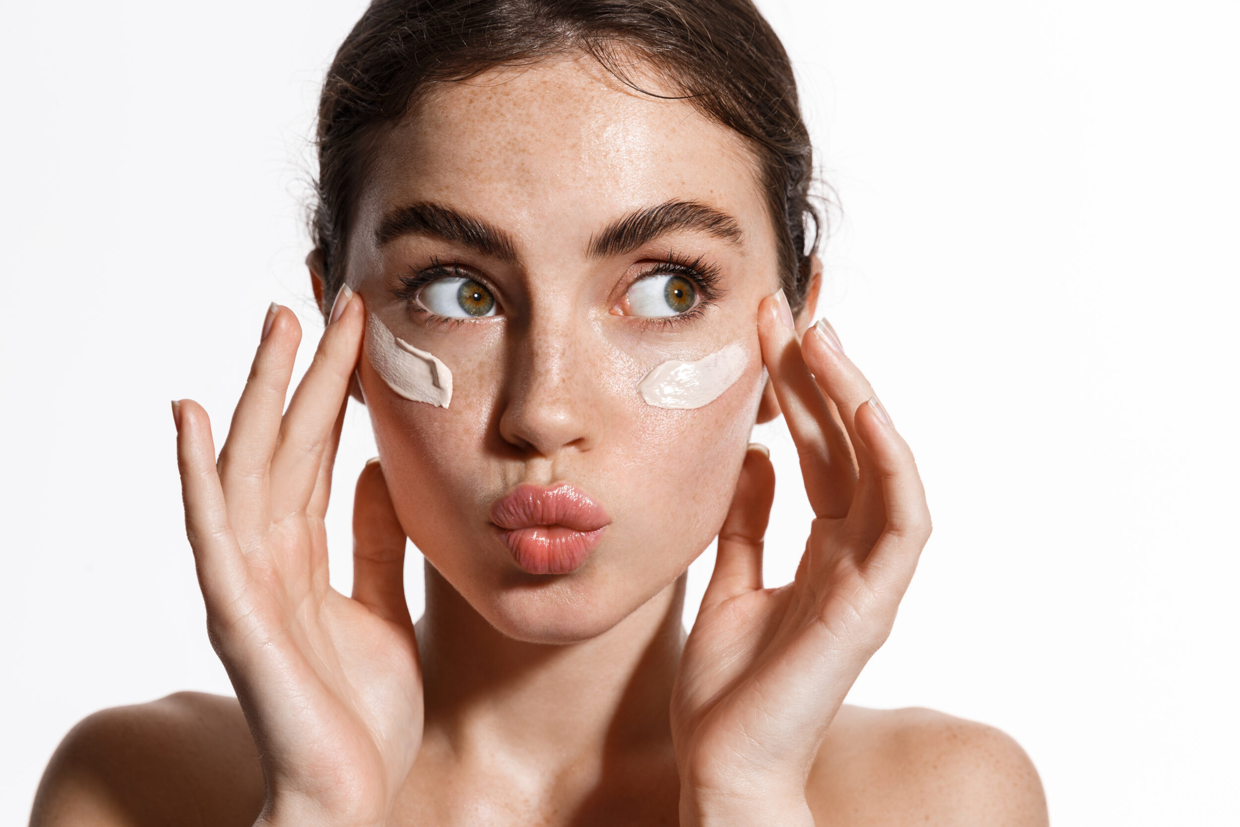 Woman making kissy face with clear skin from laser skin resurfacing in Austin, TX