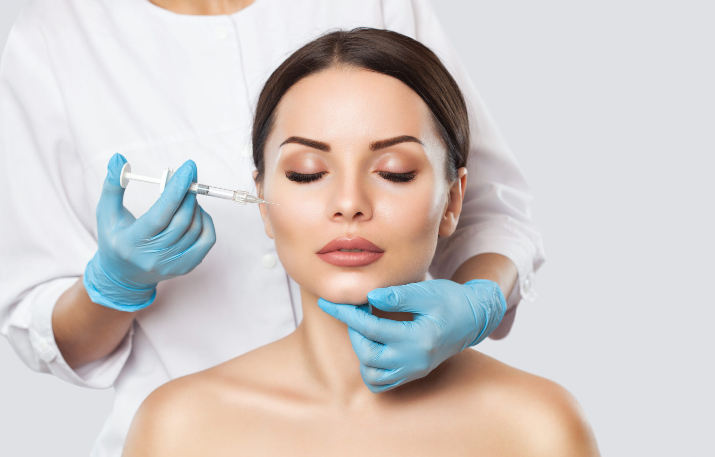 Relaxed woman getting PRP injections in her face in Austin, TX