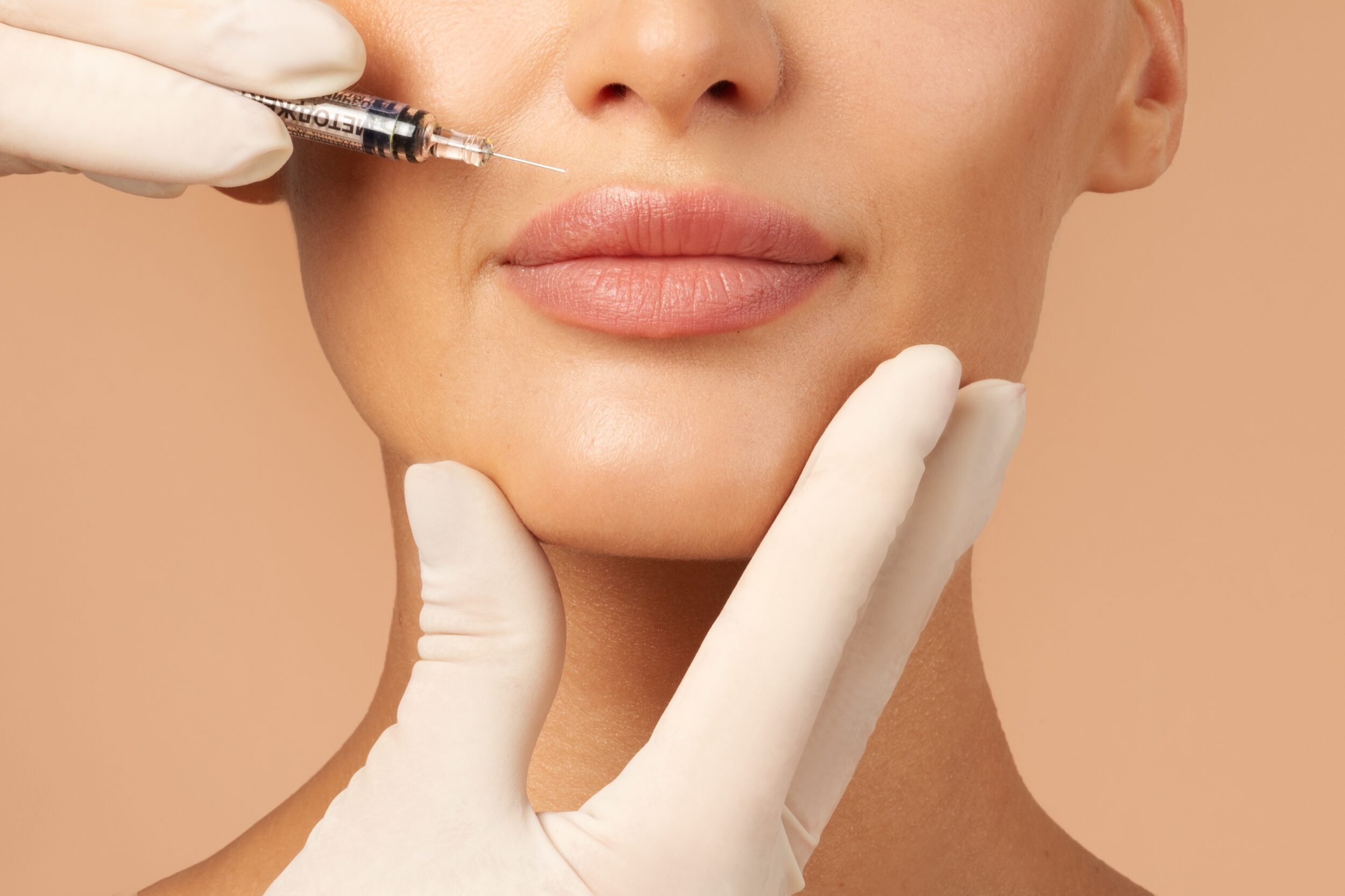 Woman's lips getting lip filler injections in Austin, TX