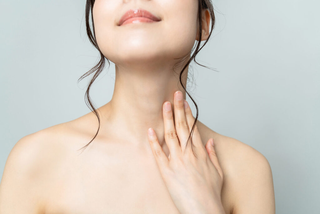 Woman's slim, contoured neckline and defined chin from Kybella or chin liposuction in Austin, TX